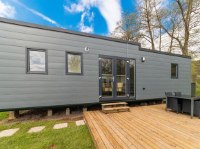 Spacious mobile home with terrace, near a brook